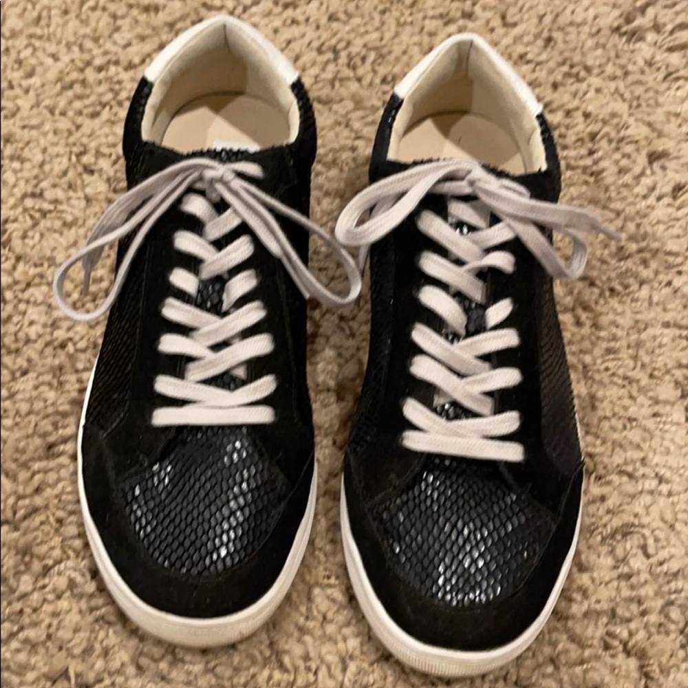 Black tennis shoes. Vici